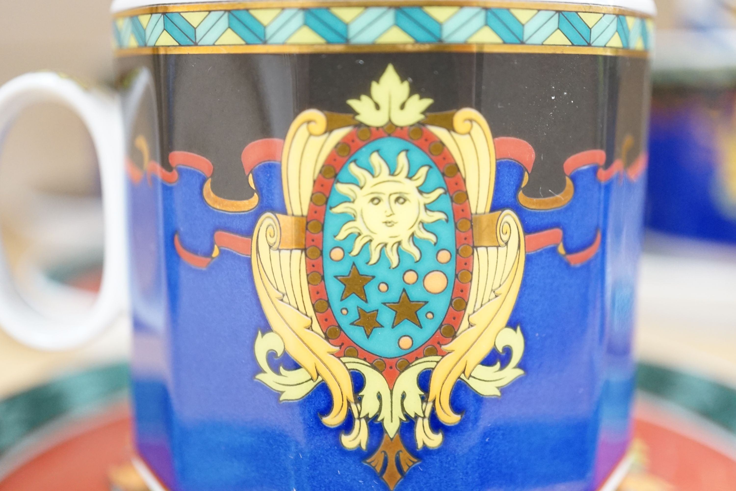 A set of eight Versace 'Le Roi Soleil' pattern cups and saucers